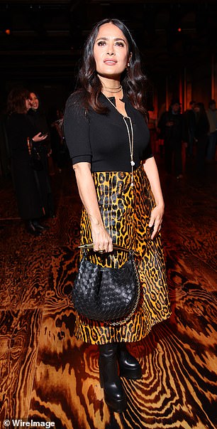 Salma Hayek took a walk on the wild side in a cheetah-print skirt for the fashion showcase