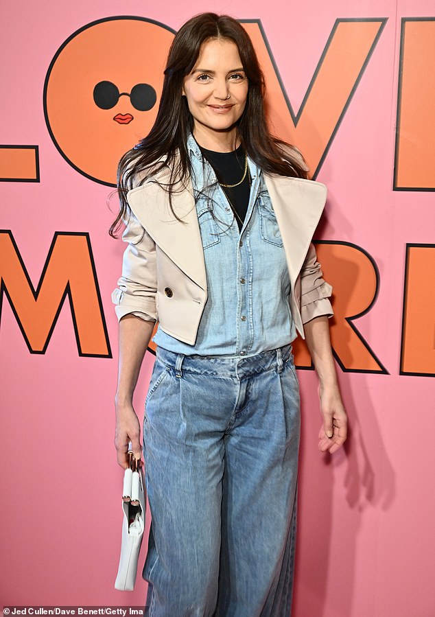 The filmmaker, who recently reunited with one of her former co-stars, wore a light blue denim button-down shirt over a black T-shirt and a sleek beige jacket.