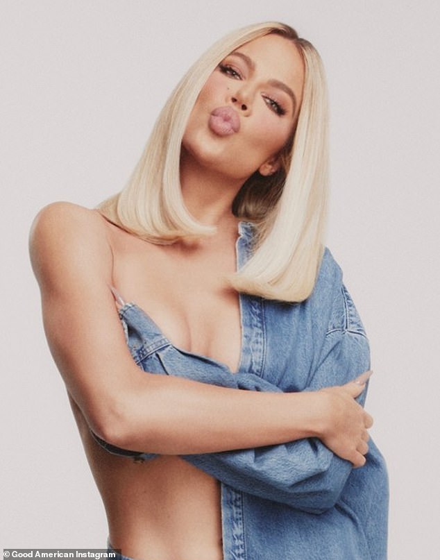 Khloe Kardashian posed topless with her arm across her chest for a Good American ad released Wednesday.