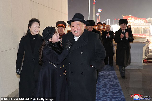 Kim Jong Un (R), his daughter, and his wife Ri Sol Ju (L) attend a military parade to celebrate the 75th anniversary of the founding of the Korean People's Army on February 8, 2023.