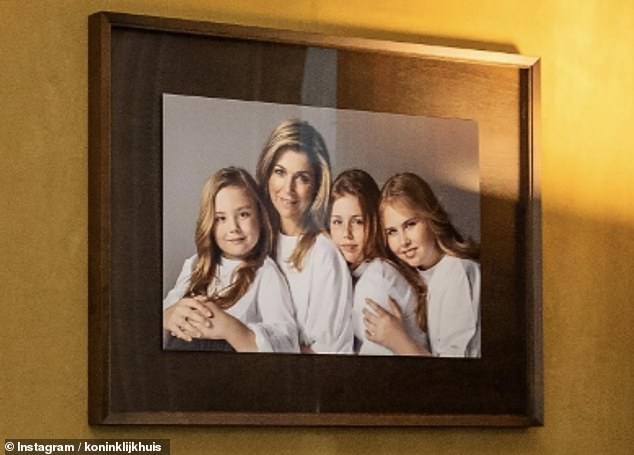 In the undated image, Máxima and her daughters wear white blouses and pose on a gray background.
