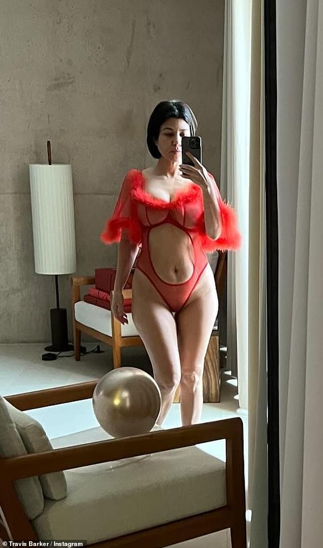 Kourtney Kardashian says she is ‘obsessed’ with Travis Barker after he shared photos of her in lingerie and a bikini in a raunchy Valentine’s Day tribute.