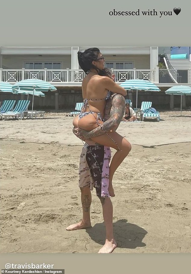 The reality TV star, 44, took to her Stories on Wednesday to repost one of the snaps from the 48-year-old rocker's post, which showed her jumping into his arms in a tiny black and white bikini. .