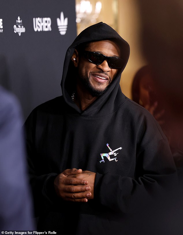 After his incredible halftime performance, Usher arrived at the star-studded event wearing a black tracksuit.