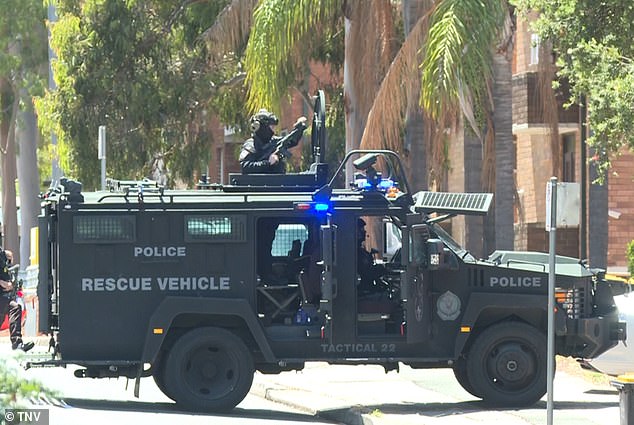 Liverpool, Sydney police operation: Wild scenes in western Sydney as a TANK-like cop truck blocks off a street as part of a massive police operation: Residents are urged to stay away
