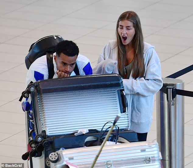 Love Island's Georgia Steel and Toby Aromolaran looked less than enamored as they boarded their flight home as they arrived at South Africa's airport on Tuesday.
