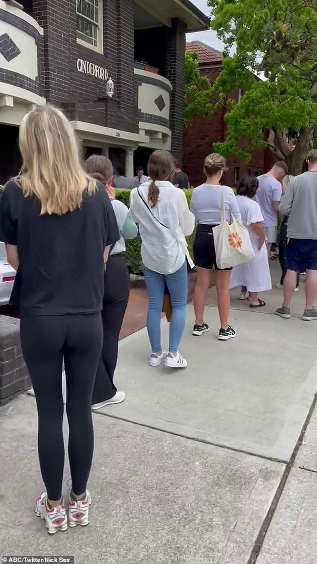 A long line of people is shown queuing to view a property as the rental crisis worsens.