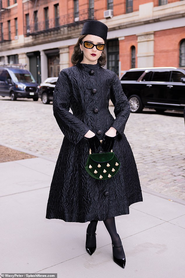 Maisie Williams rocked a stunning look during New York Fashion Week in New York City on Monday.  The 26-year-old actress looked captivating in a unique tea dress with long sleeves, sphere buttons and a wavy quilted texture.