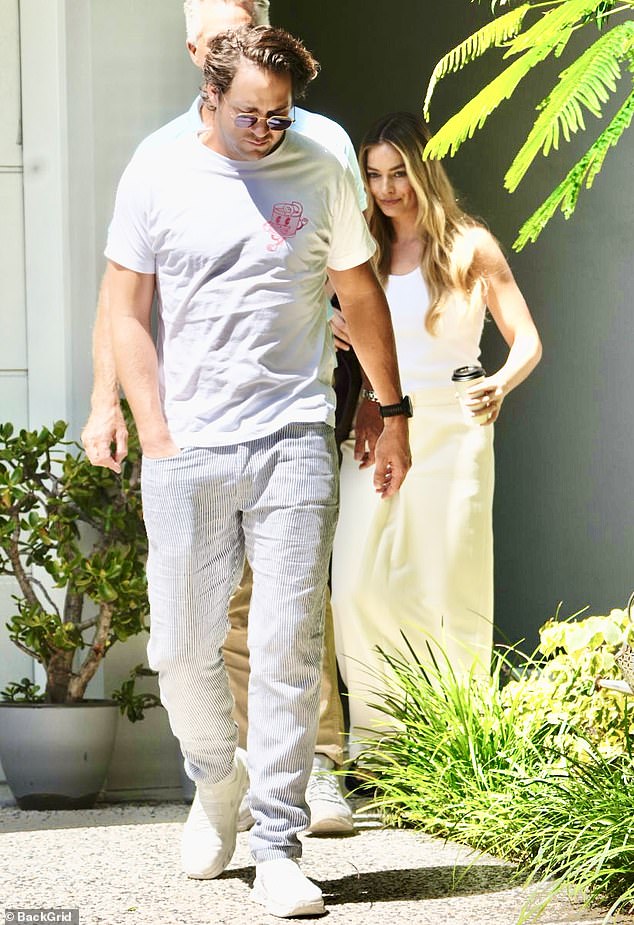 Margot Robbie looked every inch the doting daughter on Saturday afternoon.  The Barbie star, 33, who was in Australia for the AACTA Awards ceremony in QLD, couldn't wipe the smile off her face as she visited her mother Sarie Kessler's property on the Gold Coast.
