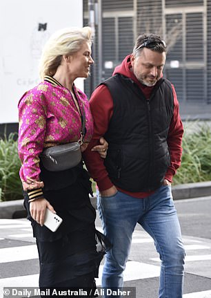 Lucinda, a wedding celebrant from New South Wales, dressed vibrantly in a bright pink cropped bomber jacket that featured shiny gold patterns.