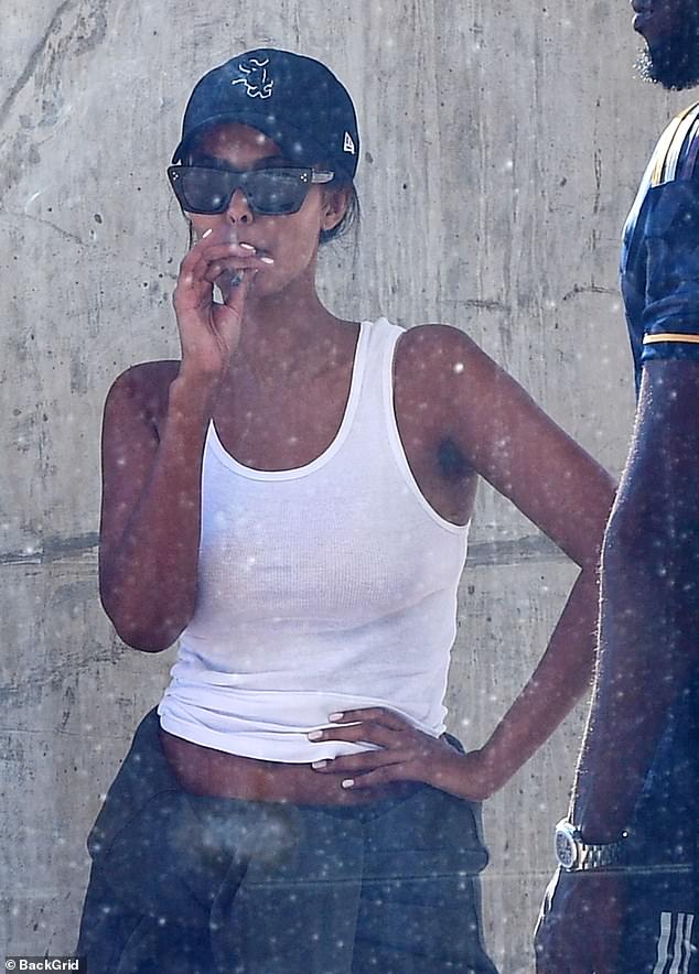 Maya Jama, 29, was spotted smoking a suspicious-looking cigarette with her boyfriend Stormzy outside Cape Town International Airport this week.