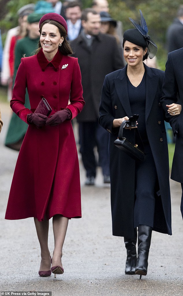 Meghan Markle 'must have been incredibly envious and then jealous of Kate (pictured together in December 2018),' royal expert claims