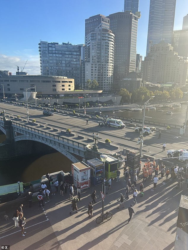 Police shot a man at Princes Bridge in Melbourne's CBD on Friday, with a large police presence currently in the area.