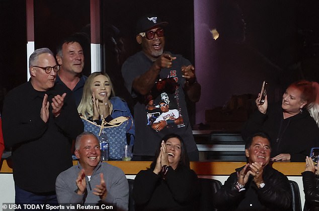 Unlike Jordan, former Bulls star Dennis Rodman (center) was at the United Center for the ceremony.