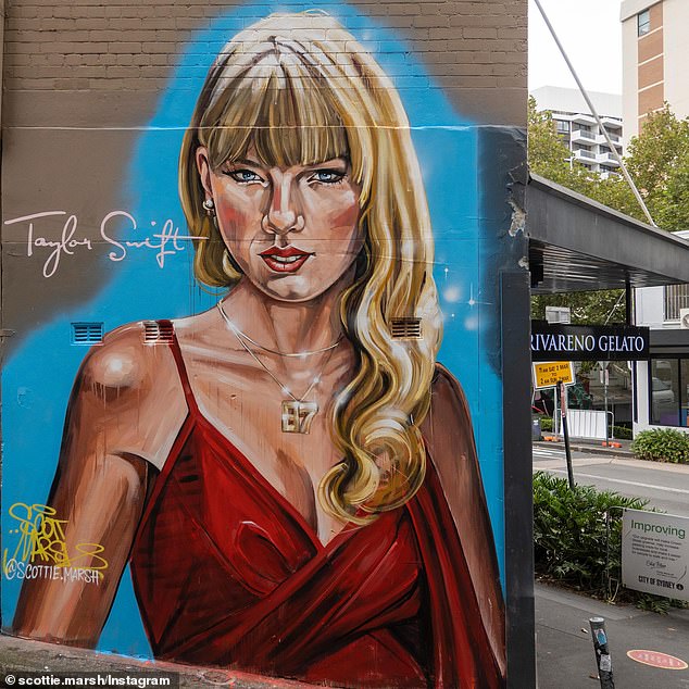 The mural on Crown Street in Sydney's CBD shows Swift wearing a low-cut red dress and an 87 diamond pendant, the jersey number worn by her NFL star boyfriend Travis Kelce.