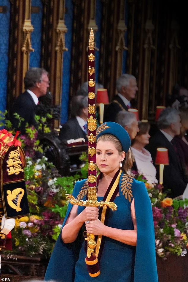 Lord Speaker of the Council, Penny Mordaunt, carrying the Sword of State, in the procession through Westminster Abbey before the coronation ceremony
