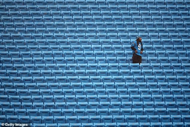 A fan watches before a game between the Atlanta Falcons and the Carolina Panthers in December.