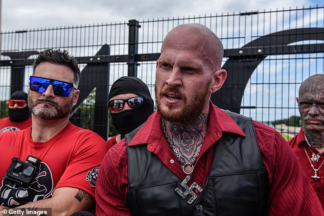 Christopher 'Hammer' Pohlhaus (pictured, center right) founded the neo-Nazi 'Blood Tribe'