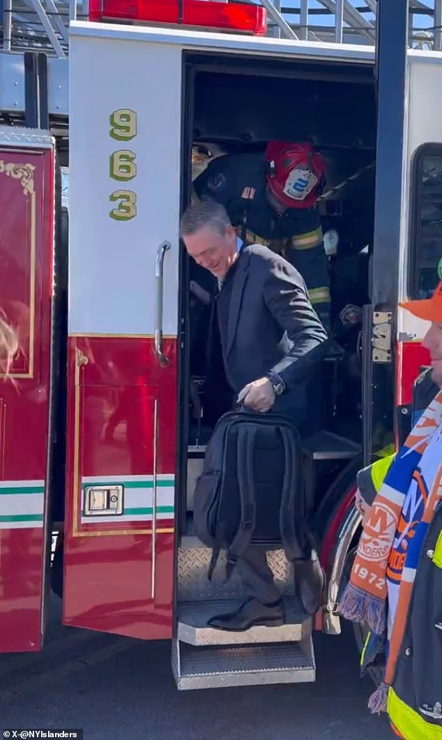 Islanders coach Patrick Roy exits a fire truck on the way to MetLife Stadium on Sunday.