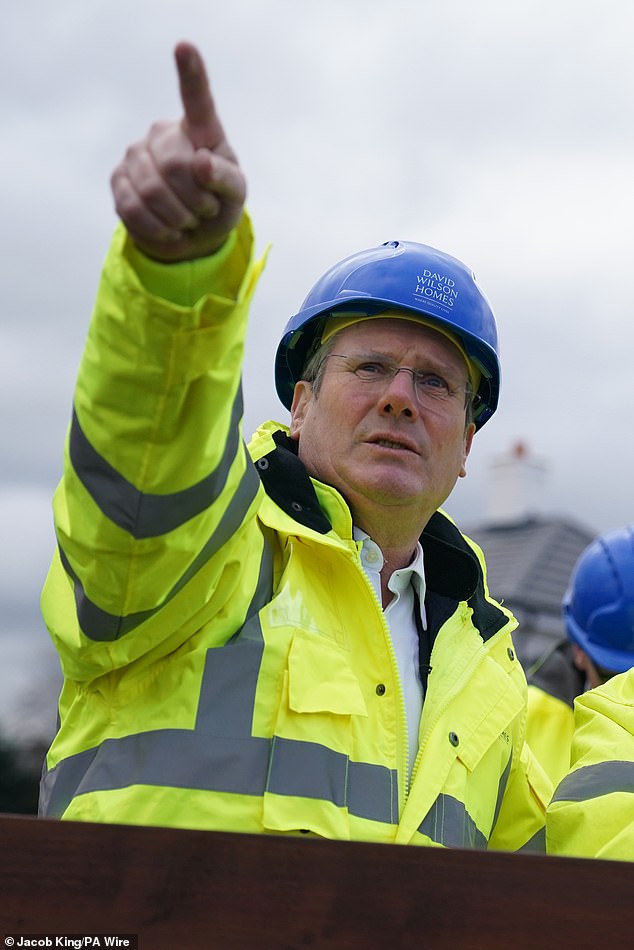 The analysis is a blow to Labor leader Sir Keir Starmer, who has promised to eliminate waits for routine treatments during his first term if he becomes Prime Minister.  The Labor leader is pictured during a visit to a newly built housing estate in Shropshire on February 26.