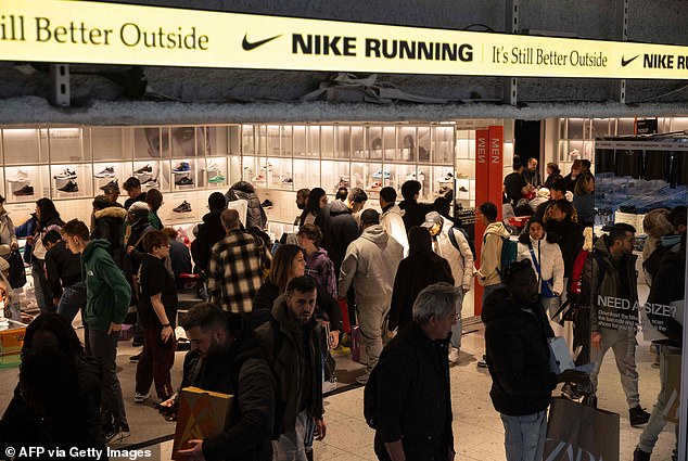 Shoppers are seen at the Nike store during 'Black Friday' in New York in November