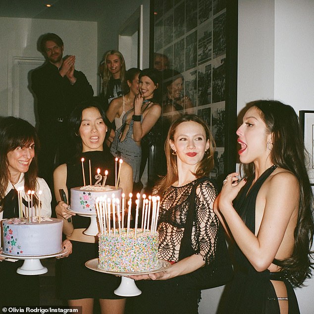 Olivia Rodrigo (right) hosted a star-studded birthday party in the hours before she officially turned 21 and became a legal adult in the United States on Tuesday.