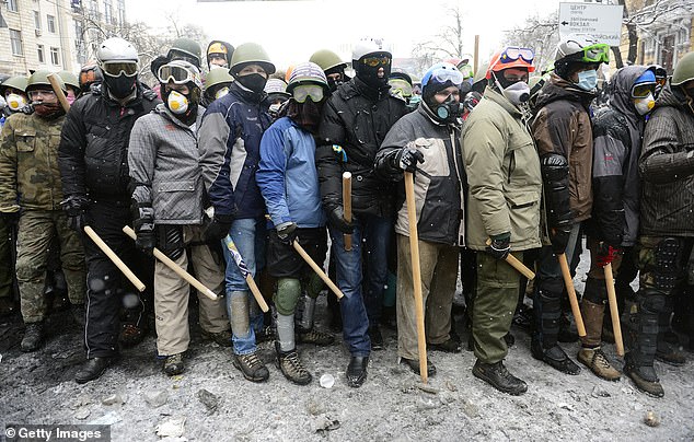 Militant protesters gather on the streets of the capital kyiv in early 2014, in the run-up to the overthrow of Ukraine's elected head of state.