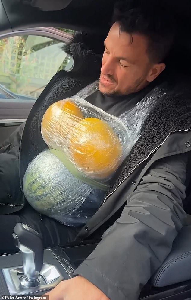 Peter Andre 'imitated' his wife Emily MacDonagh's pregnancy by tying heavy melons to her chest and stomach for a bizarre video on Monday.