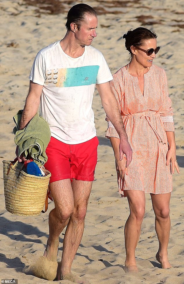 Pippa, 40, is currently on holiday in St Barts with her husband James Matthews (pictured, left) and the couple's three children.