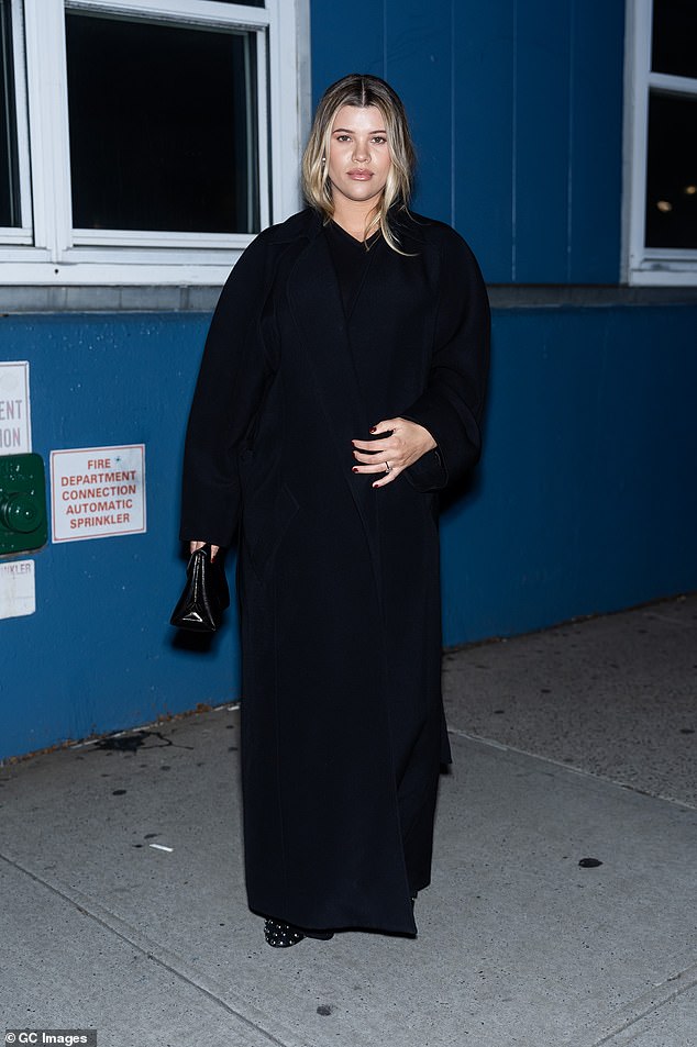 Pregnant Sofia Richie covered up her growing baby bump on Saturday while attending the star-studded Khaite fashion show during New York Fashion Week.