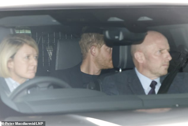 Prince Harry is pictured arriving at Clarence House in London to meet his father.