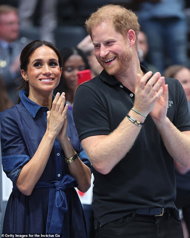 Prince Harry and Meghan Markle cheering on the players in last year's volleyball final during day six of the Invictus Games.