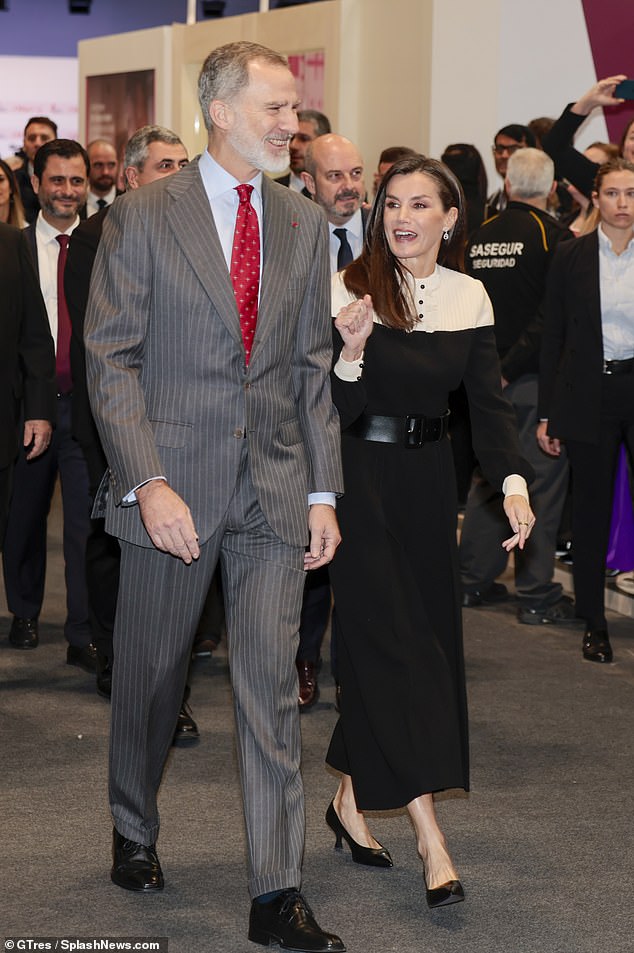 Letizia was with her husband, King Felipe VI, who looked dapper in a gray striped suit paired with a red tie.
