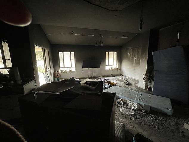 On Wednesday you see the inside of one of Be'eri's houses.  The walls are blackened by smoke, while rubble and other debris can be seen scattered on the ground.