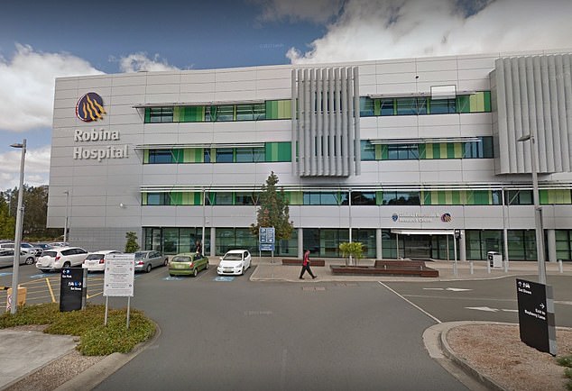 A man who appeared to be armed locked down Robina Hospital (pictured) on the Gold Coast for about an hour from midday on Tuesday before he was arrested.