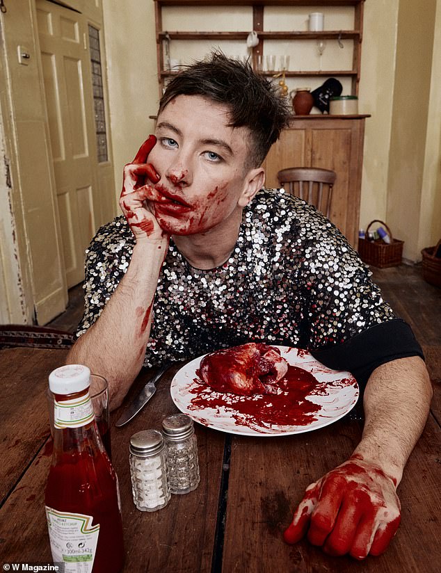 In the next photo he went one step further, pretending to devour a heart while sitting on a plate covered in fake blood.