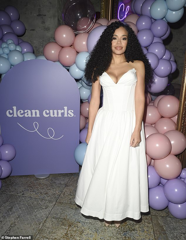 Sarah-Jane Crawford flaunts her incredible figure in a plunging white dress as she celebrates launch of her new haircare range with glitzy party