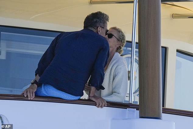 Sarah Murdoch and her billionaire husband Lachlan packed on the PDA while watching the SailGP championship in Sydney on Sunday.