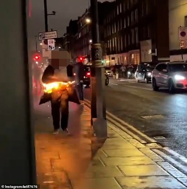 This is the shocking moment when a man on fire runs down a London street