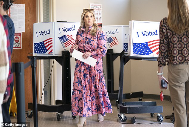 South Carolina held early voting from February 12 to 22. A woman in Columbia, South Carolina, participates in early voting on Thursday, the last day to cast her ballot before polls open at 7 a.m. Saturday for Election Day.