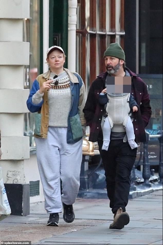 Succession star Sarah Snook is seen with her baby daughter for the first time as she enjoys a day out in London with husband Dave Lawson – after sweeping the board at award season