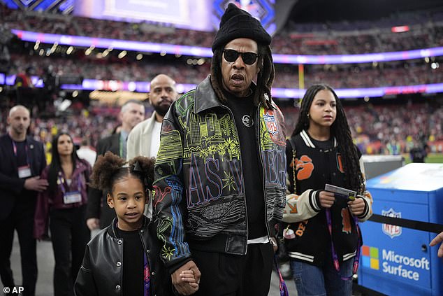 Jay-Z, 54, was photographed with his daughters Blue Ivy, 12, and Rumi, six, at Super Bowl LVIII at Allegiant Stadium in Las Vegas, pitting the Kansas City Chiefs against the San Francisco 49ers. .