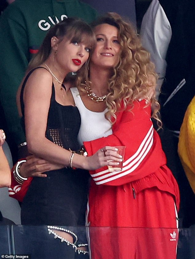 The 36-year-old actress hugged Taylor's waist as she joined the 34-year-old hitmaker in cheering on her Kansas City Chiefs tight end boyfriend Travis Kelce.