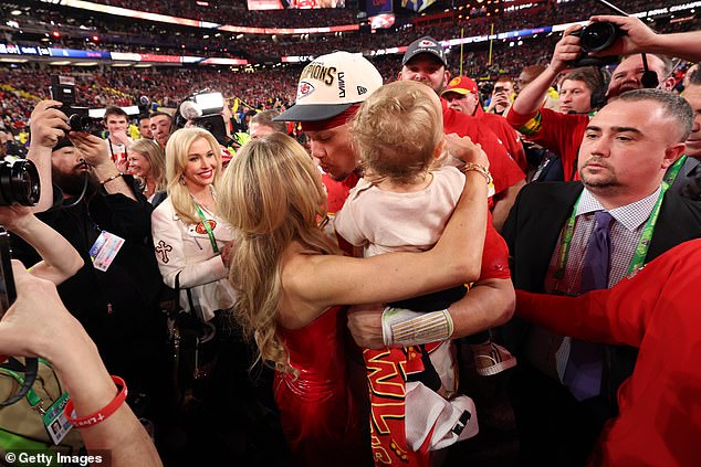 Brittany Mahomes, 28, was seen sharing a sweet kiss with her husband, Patrick Mahomes, while celebrating the Kansas City Chiefs winning Super Bowl LVIII against the San Francisco 49ers on Sunday.