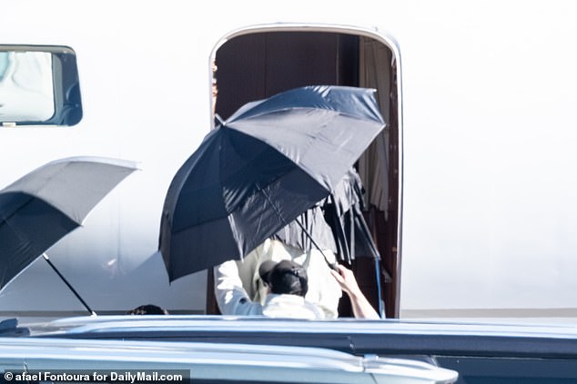 Taylor Swift leaves Las Vegas shielded by umbrellas after celebrating Travis Kelce’s epic Super Bowl triumph until 5am in Sin City – with Blake Lively joining singer on her private jet