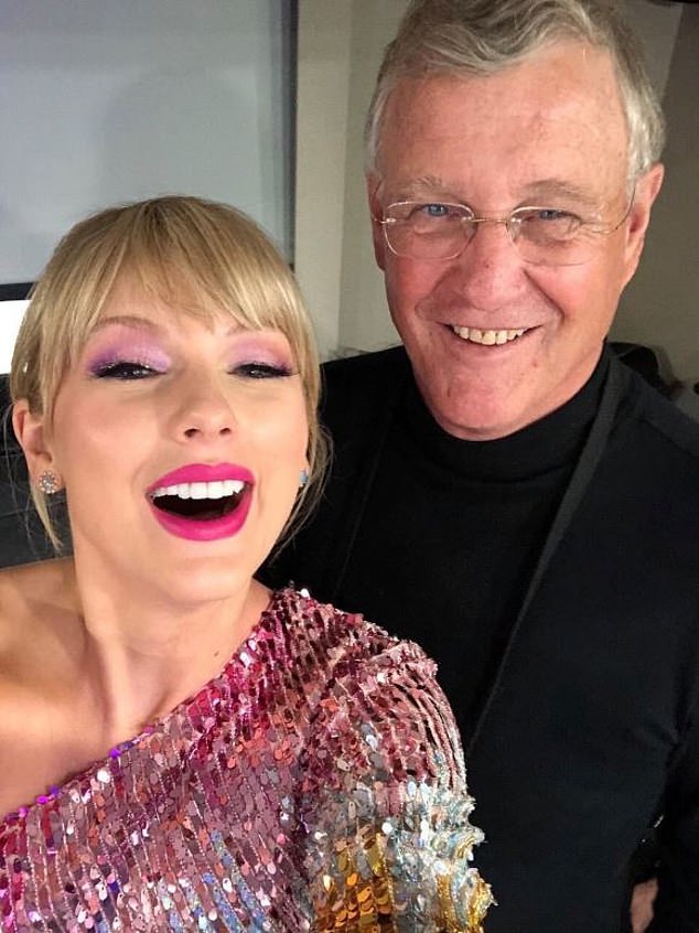 Taylor Swift's father Scott (pictured with the singer) incredibly gifted some lucky fans $2,000 VIP bracelets on the first night of the Australian leg of her Eras tour on Friday.