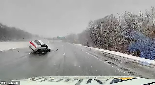 Massachusetts ambulance driver Tim Crosbie narrowly avoided an overturning car while transporting a patient on Interstate 95 in Peabody.  As a white sedan moved down the road, Scobie was forced to quickly turn right to avoid it.