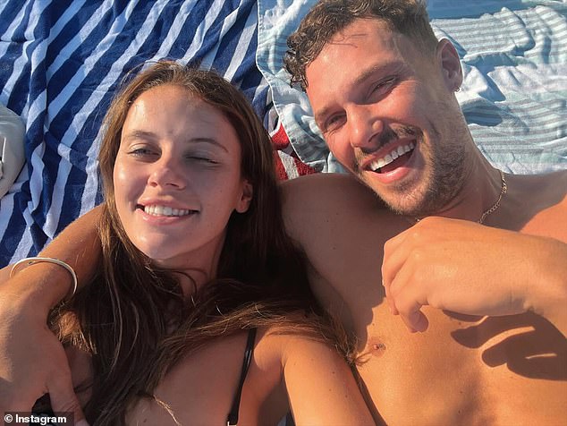 The Block star Josh Packham (right) debuted his new romance with model girlfriend Tess Homann (left) by sharing this adorable beach selfie on Tuesday.