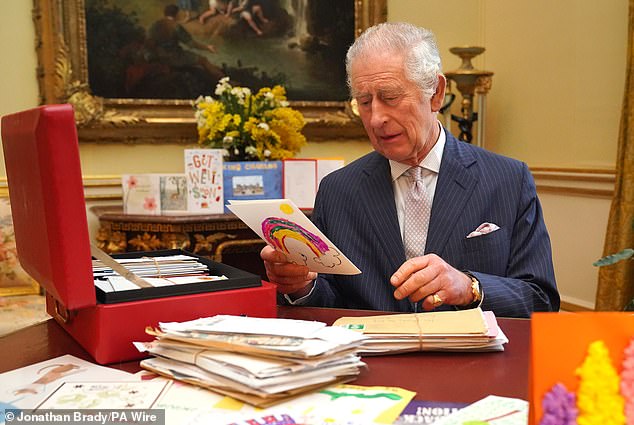 Some of the correspondence has moved Charles to tears. In the photo: The King holding a card sent by a well-wisher.