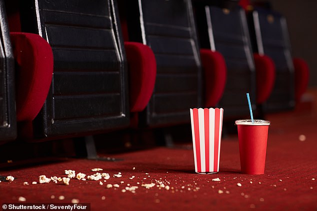 With rain forecast across much of the UK this weekend, many Brits will be planning a cozy trip to the cinema.  But a new study may encourage you to carry disinfectant spray along with your snacks (file image)